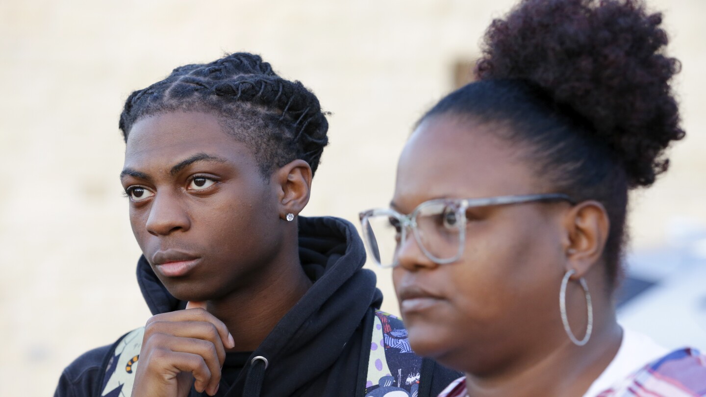 Black student suspended over his hairstyle to be sent to an alternative education program | AP News