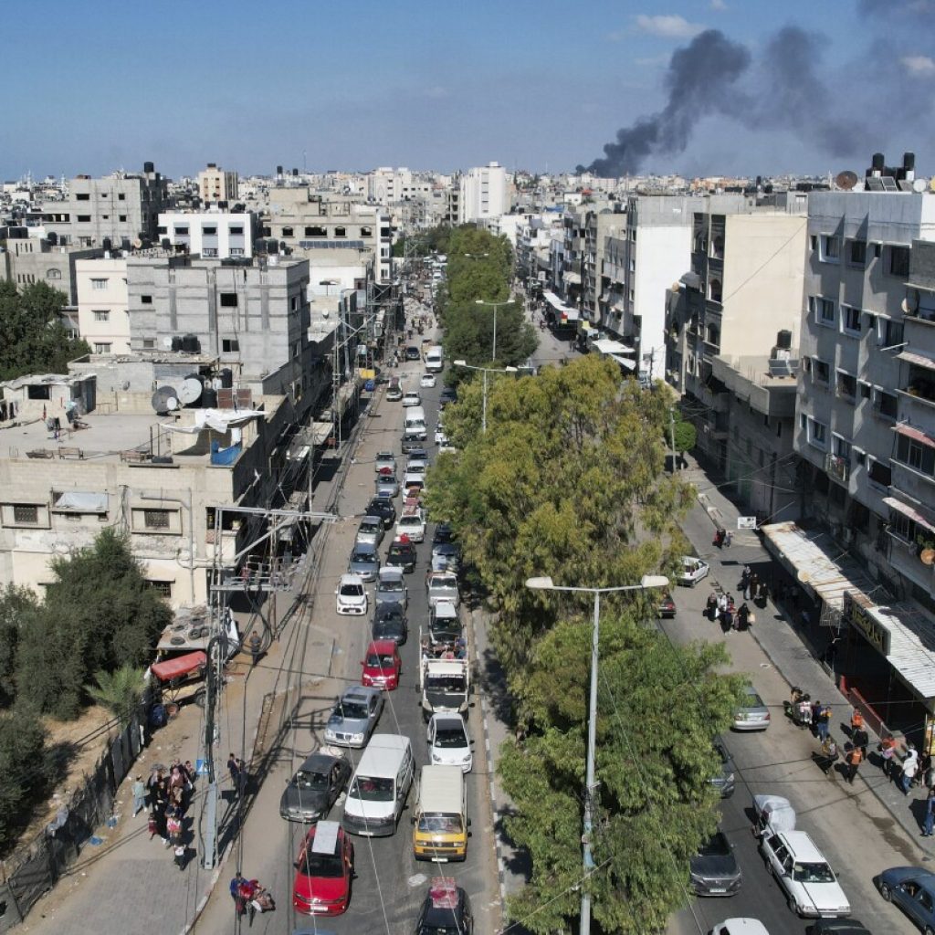 Palestinian mother fears for her children as she wonders about the future after evacuating Gaza City | AP News