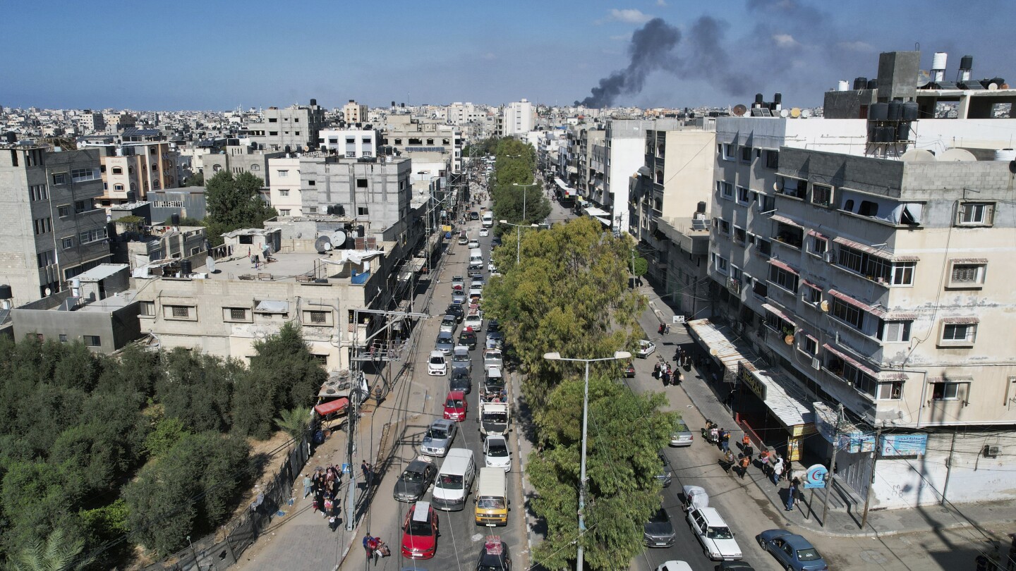 Palestinian mother fears for her children as she wonders about the future after evacuating Gaza City | AP News