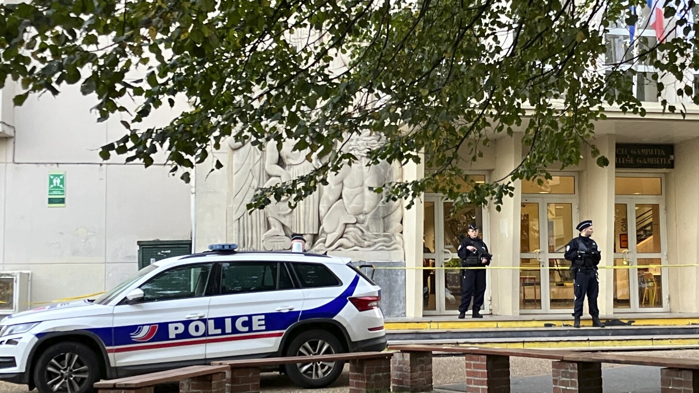 French schools hold a moment of silence in an homage to a teacher killed in a knife attack | AP News