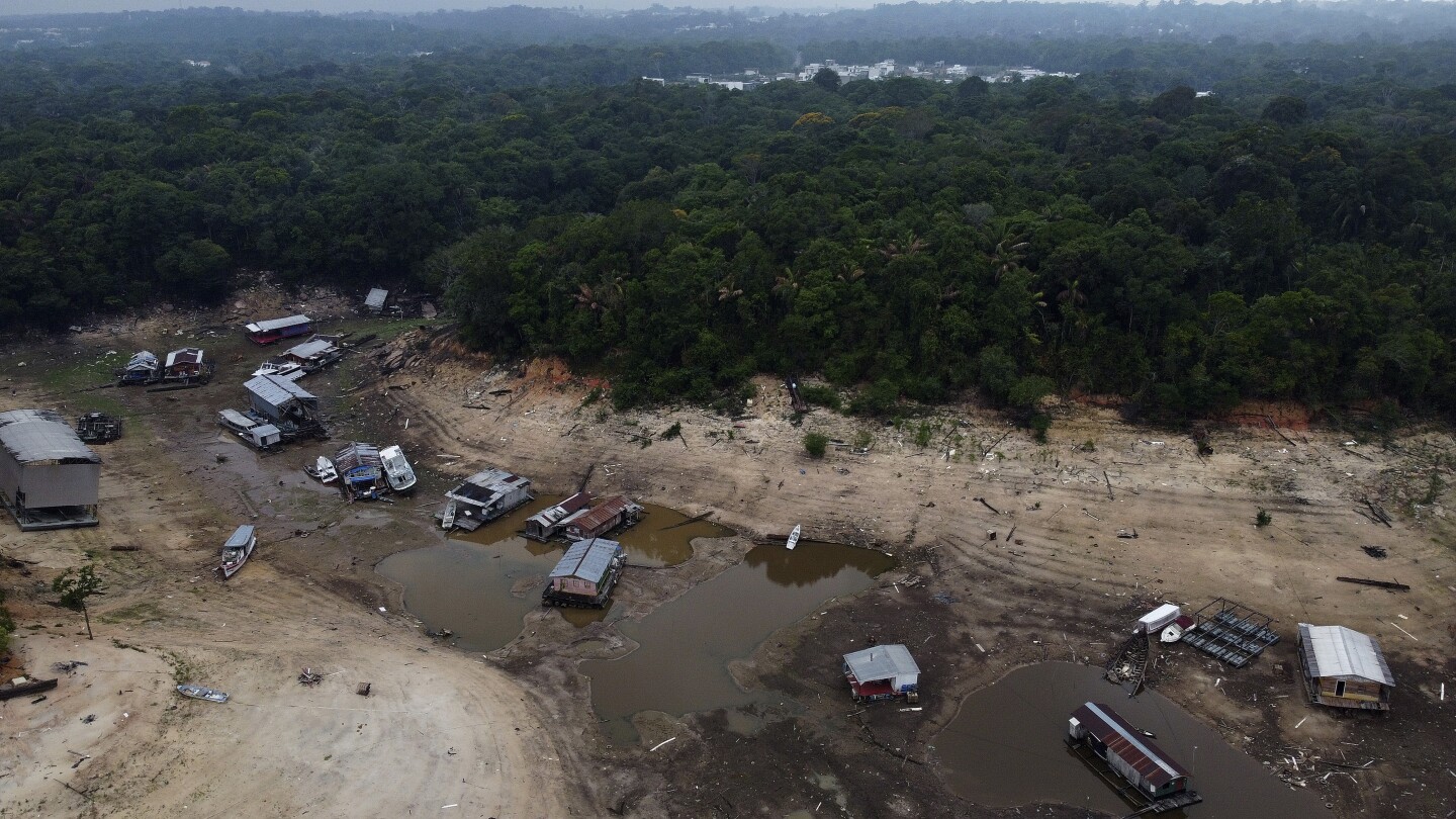 In Brazil’s Amazon, rivers fall to record low levels during drought | AP News