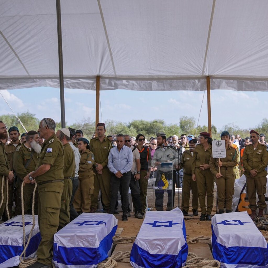 Hundreds mourn as Israeli family of 5 that was slain together is laid to rest | AP News