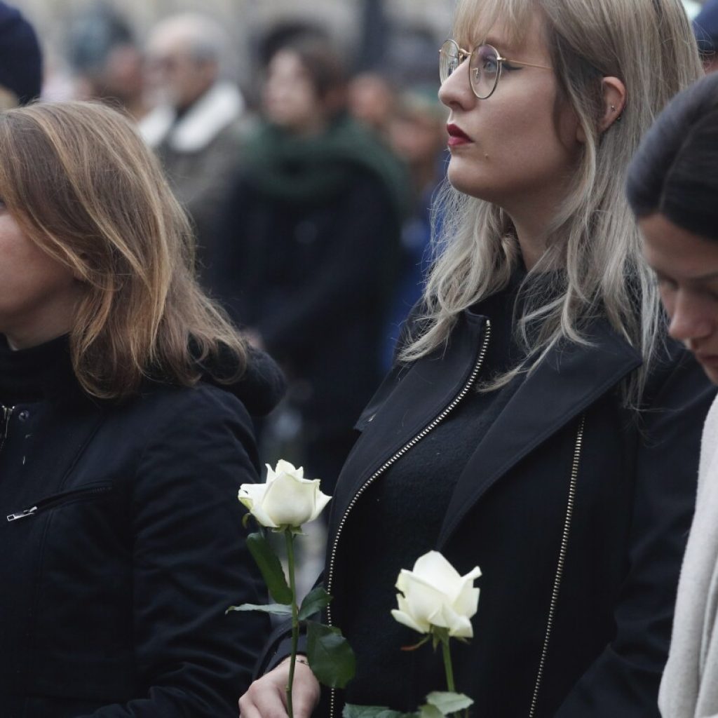 French presidential couple attend funeral service of teacher slain in school attack | AP News