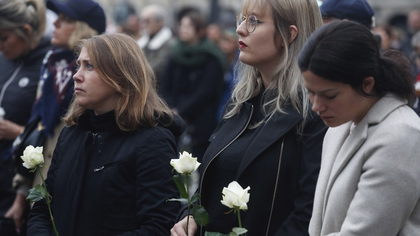 French presidential couple attend funeral service of teacher slain in school attack | AP News