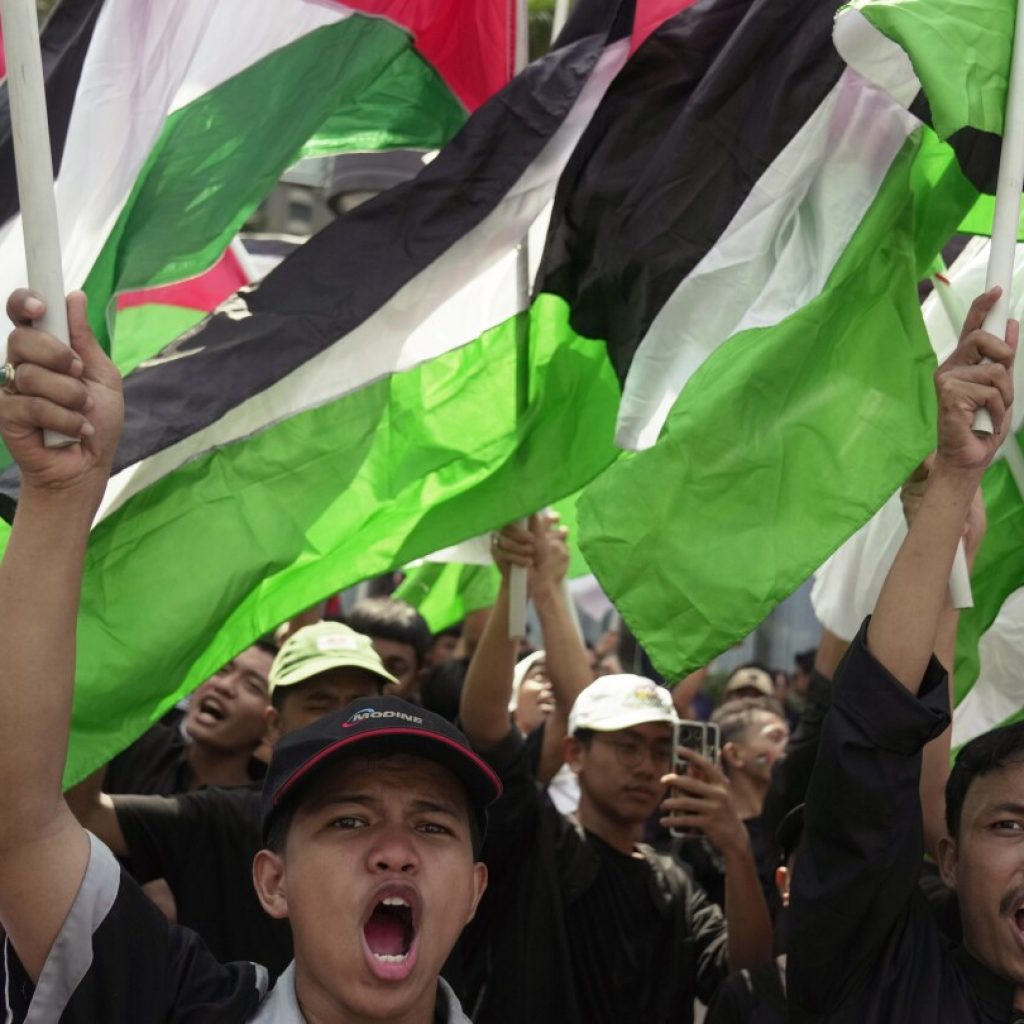 Protesters march to US Embassy in Indonesia over Israeli airstrikes | AP News