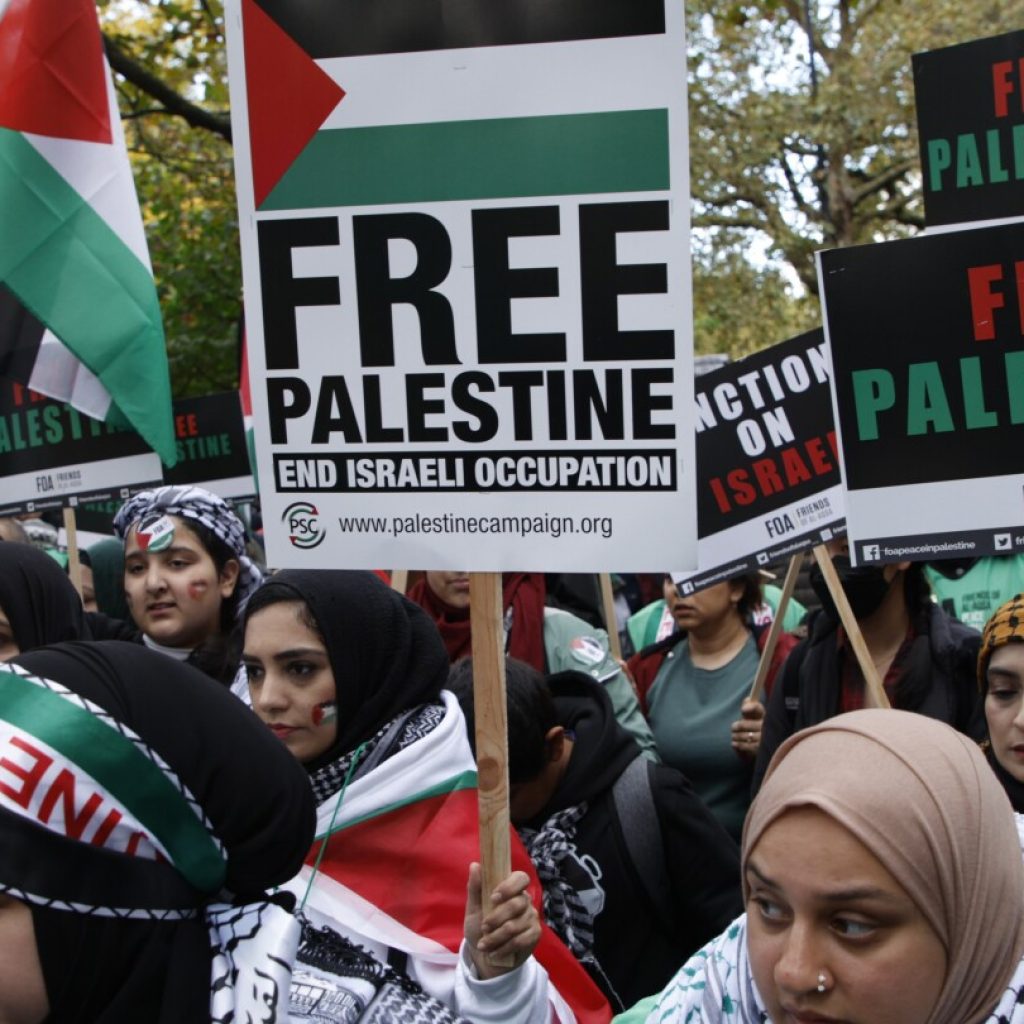 Thousands of pro-Palestinian demonstrators march in London as Israel-Hamas war roils the world | AP News