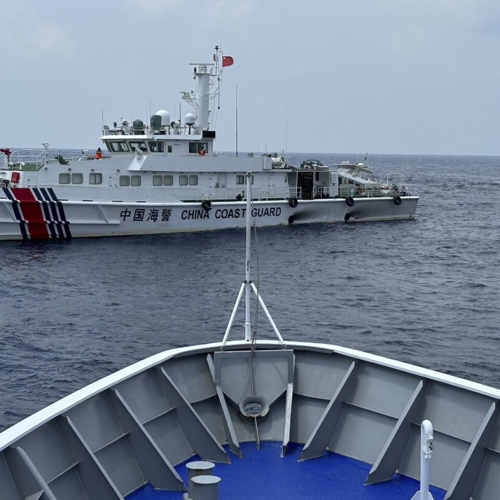 Philippines says a coast guard ship and supply boat are hit by Chinese vessels near disputed shoal | AP News