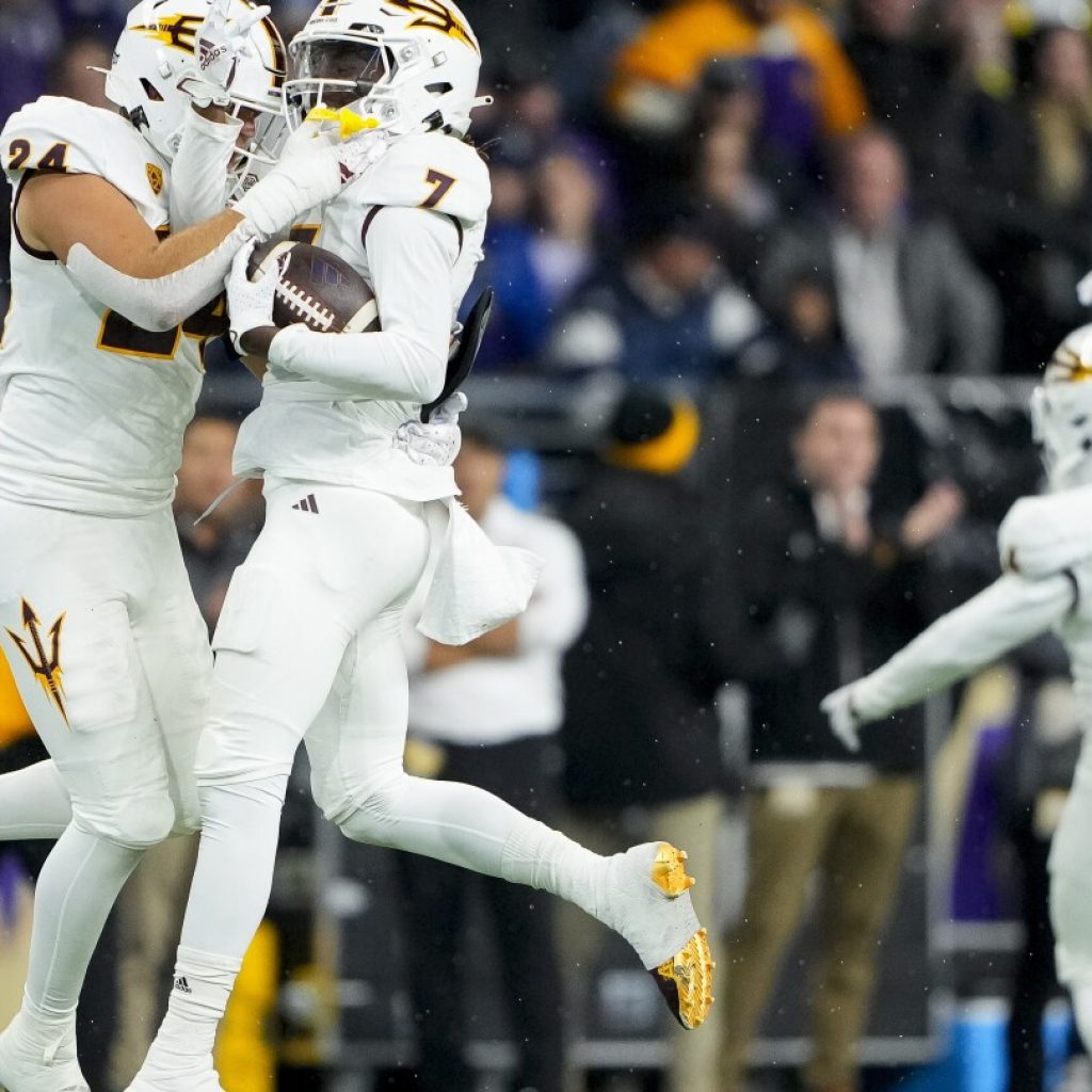 Powell returns late interception 89 yards for TD, No. 5 Washington survives Arizona State 15-7 | AP News