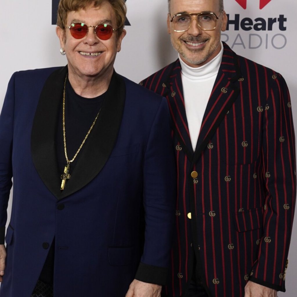 Hundreds of photos from the collection of Elton John and David Furnish will go on display in London | AP News