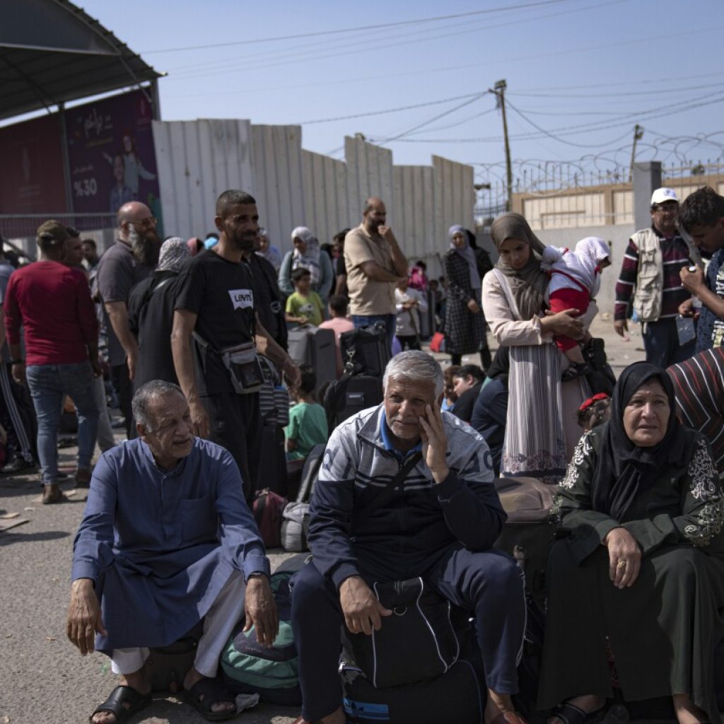 Stranded at a closed border as bombs fall, foreign nationals in besieged Gaza await evacuation | AP News