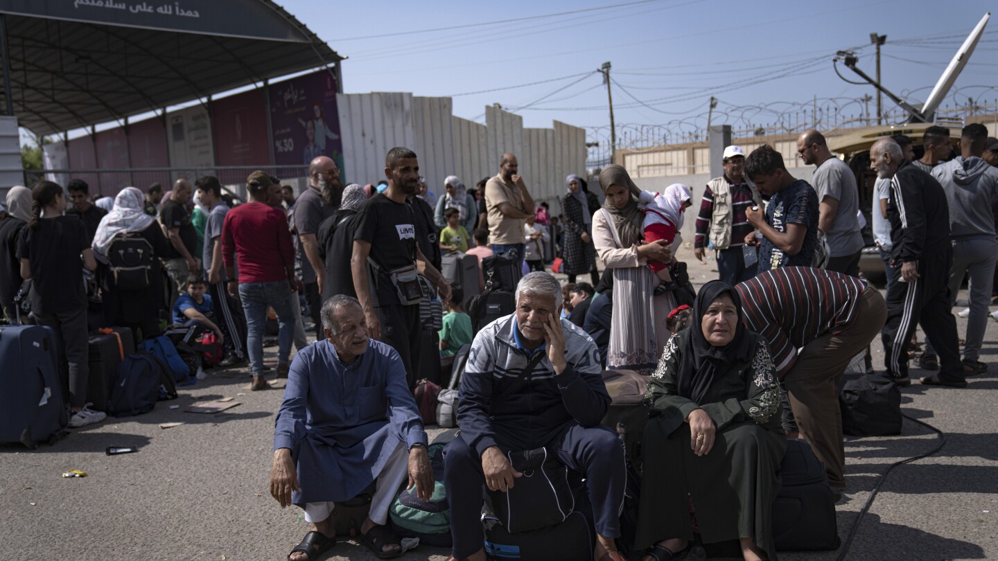 Stranded at a closed border as bombs fall, foreign nationals in besieged Gaza await evacuation | AP News