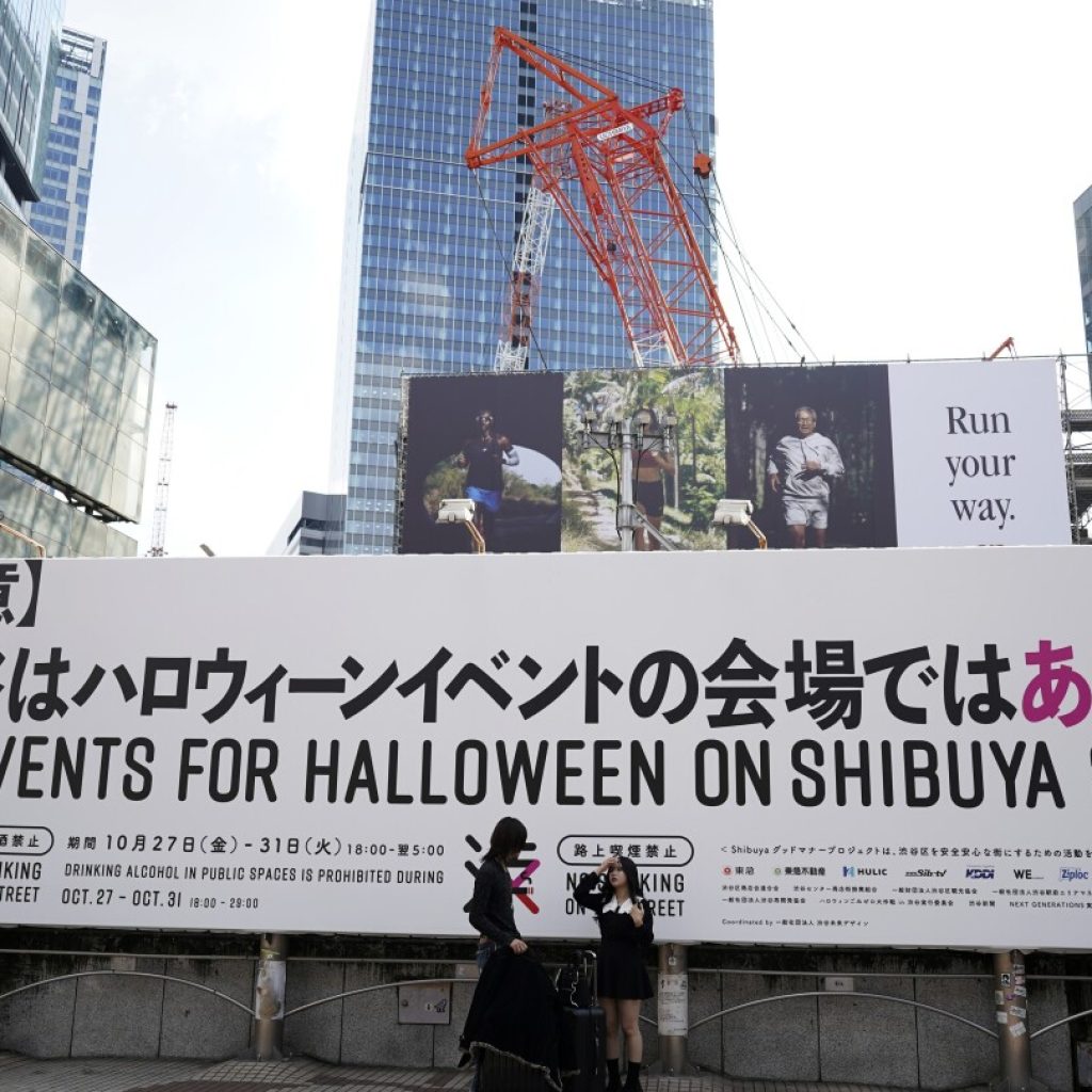 Tokyo’s Shibuya district raises alarm against unruly Halloween, even caging landmark statue | AP News