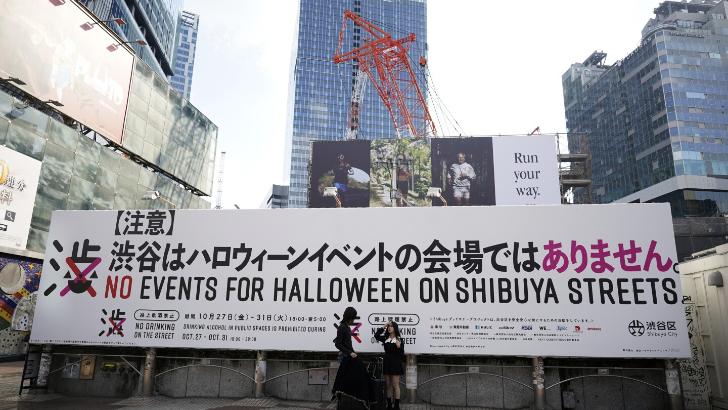 Tokyo’s Shibuya district raises alarm against unruly Halloween, even caging landmark statue | AP News