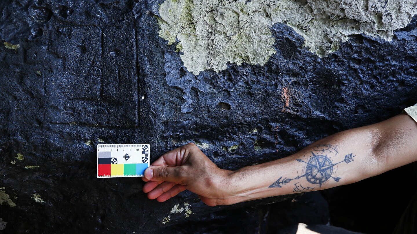 Severe drought in the Amazon reveals millennia-old carvings | AP News