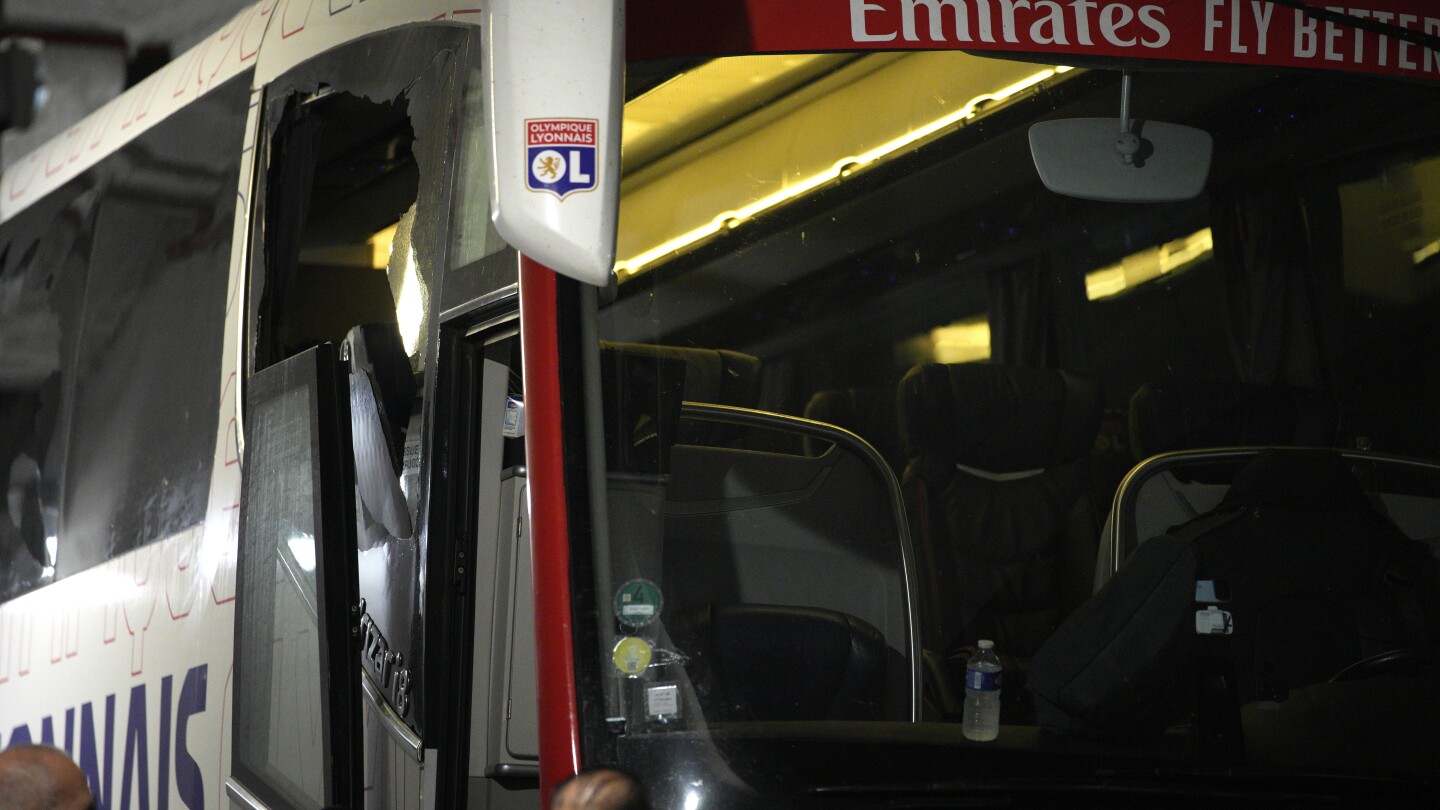 Coach Fabio Grosso hurt as Lyon team bus comes under attack before French league game at Marseille | AP News