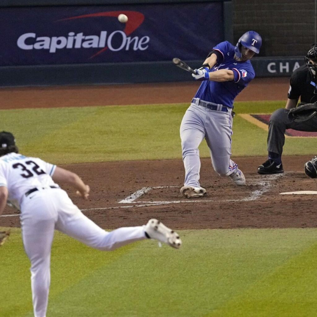 Seager stars with 2-run HR, stellar defense to lead Rangers over D-backs 3-1 in World Series Game 3 | AP News