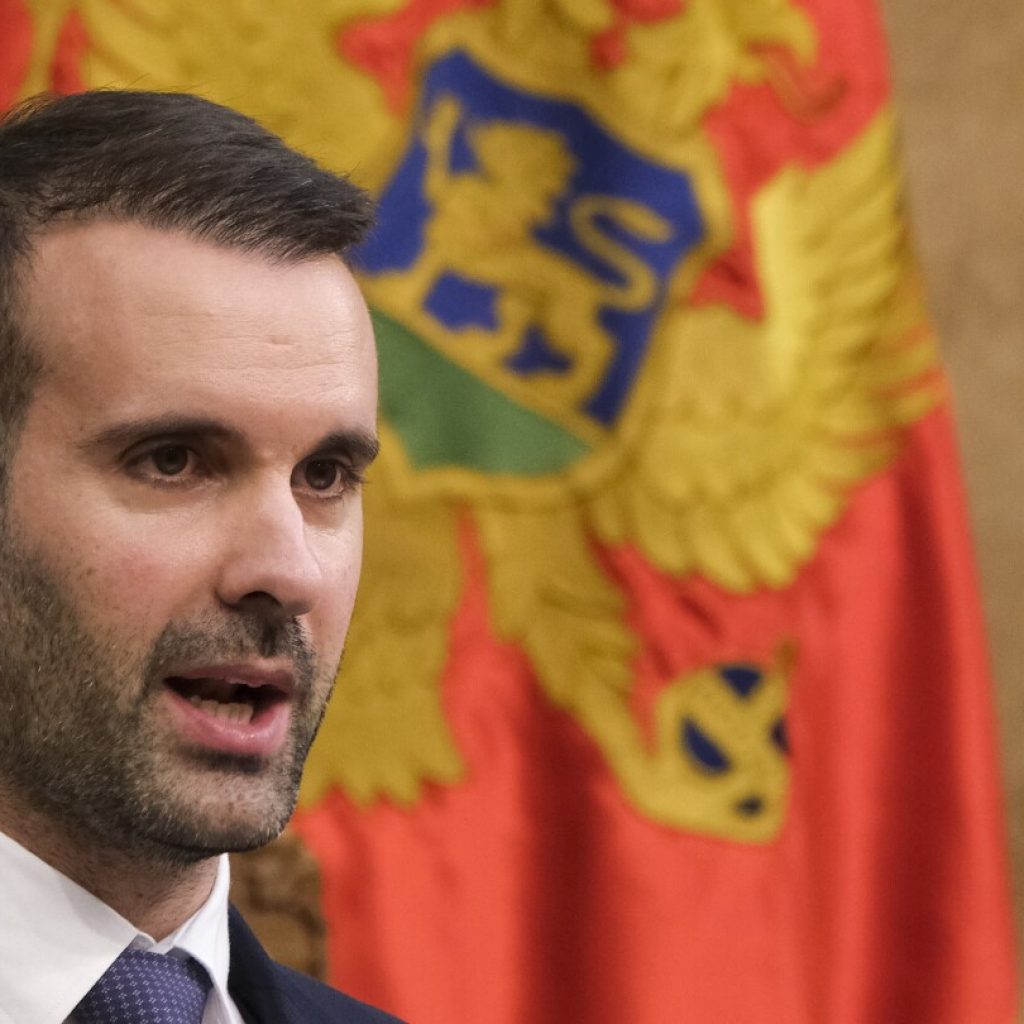 Montenegro gets new government, promises to unblock EU integration as EU Commissioner visits | AP News