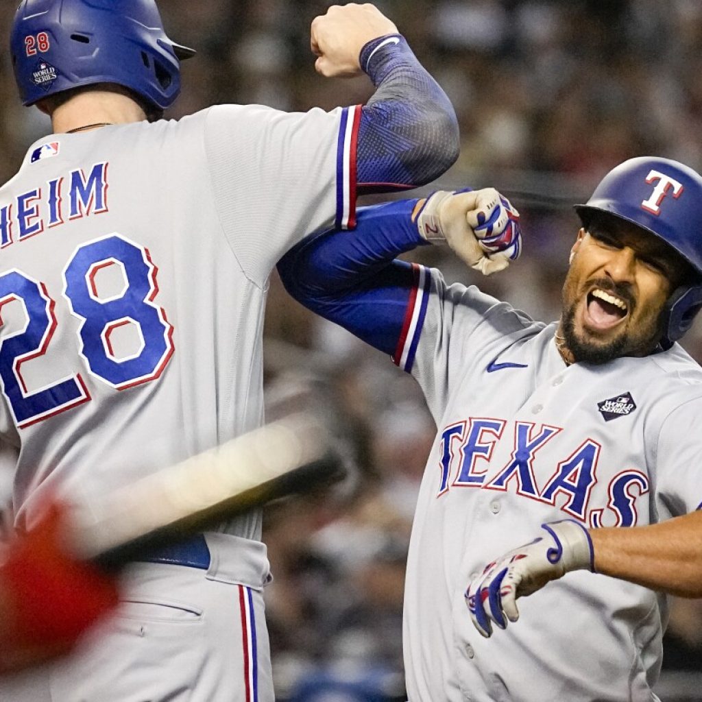 Semien’s 5 RBIs, Seager’s home run lead Rangers over Diamondbacks 11-7 for 3-1 World Series lead | AP News