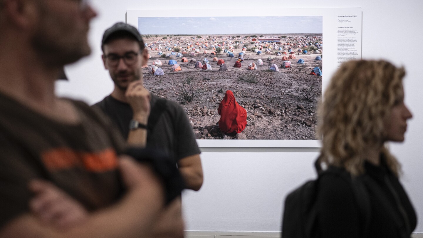 Hungary bans teenagers from visiting World Press Photo exhibition over display of LGBTQ+ images | AP News