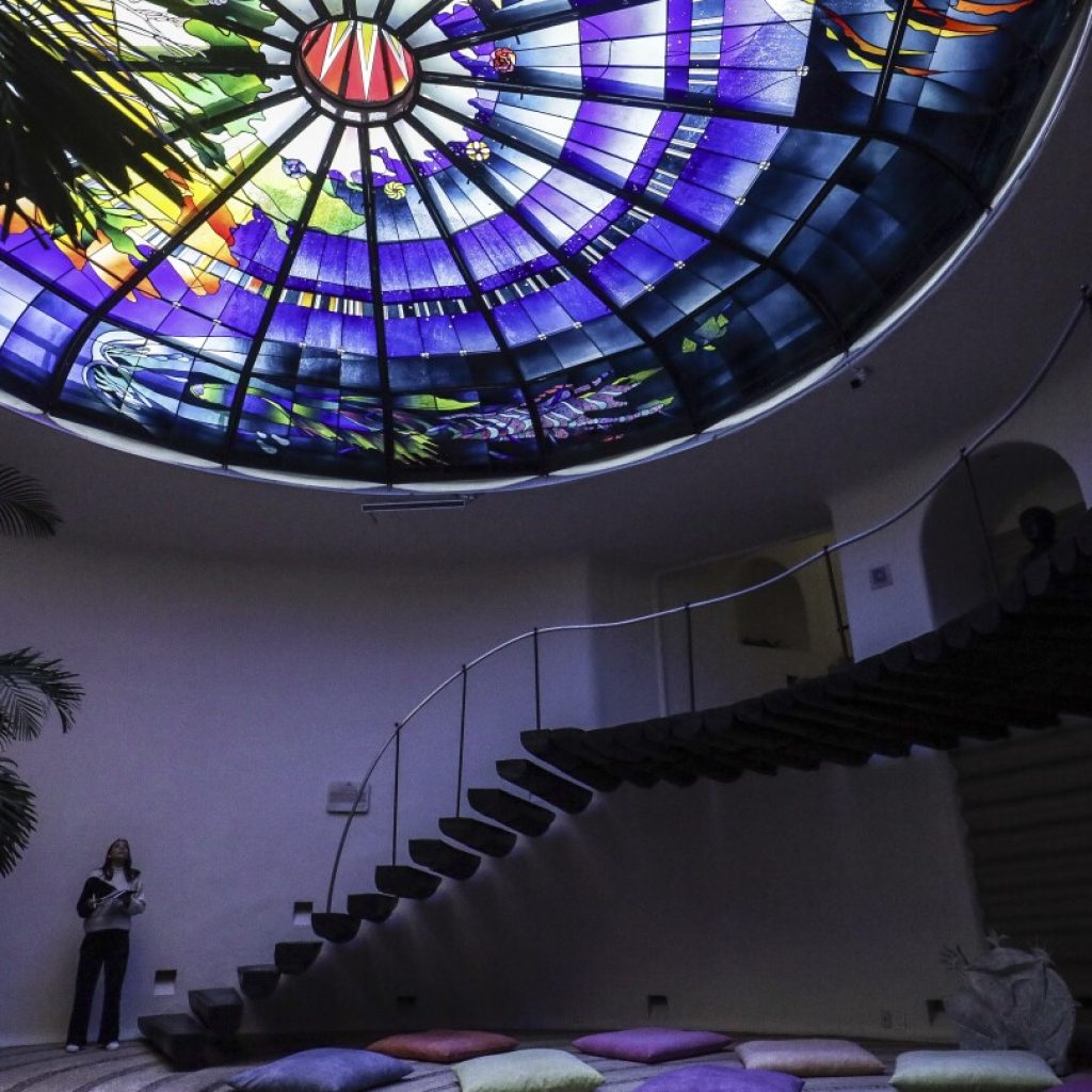 Renowned glass artist and the making of a football field-sized church window featured in new film | AP News