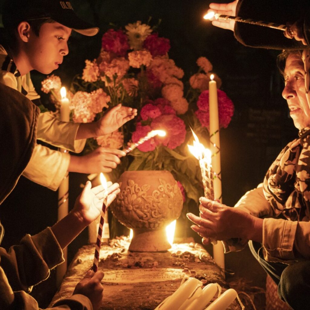 With flowers, altars and candles, Mexicans are honoring deceased relatives on the Day of the Dead | AP News