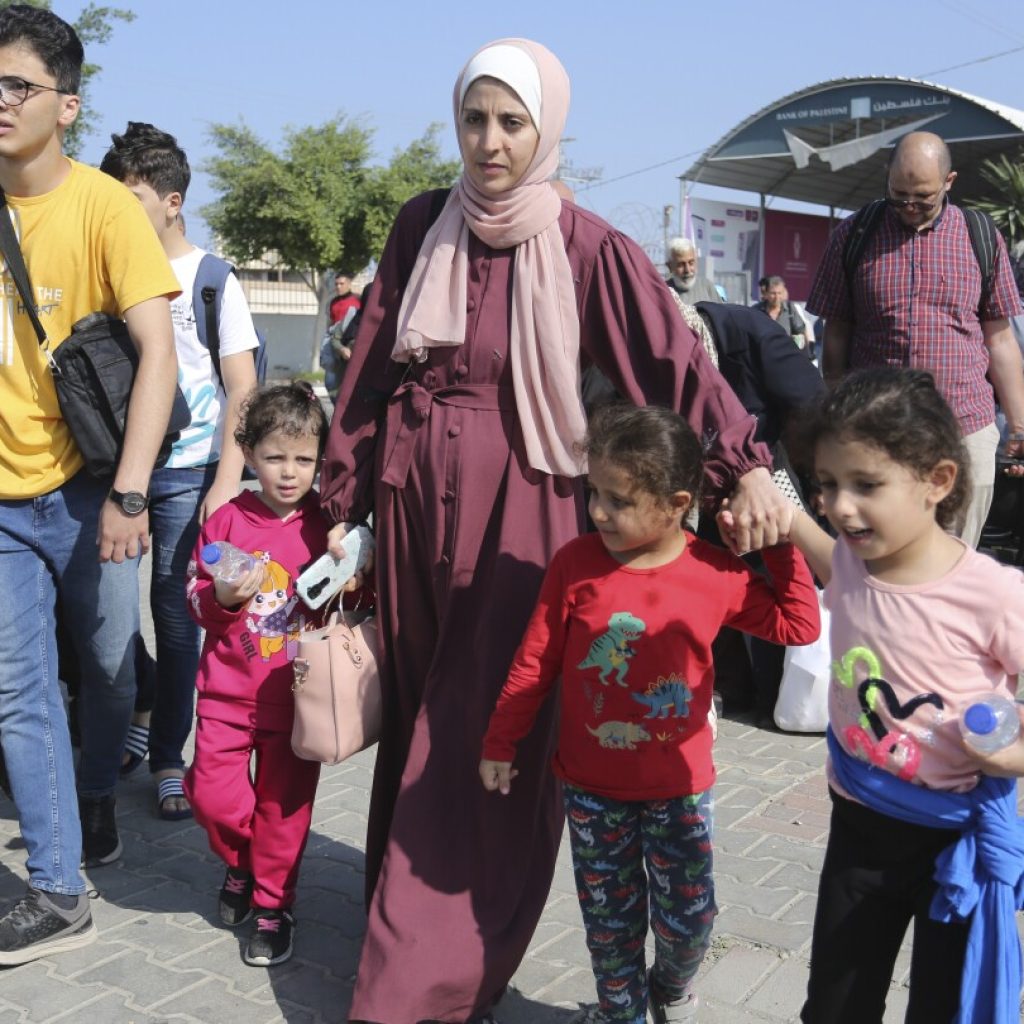 Confusion, frustration and hope at Gaza’s border with Egypt as first foreign passport-holders depart | AP News