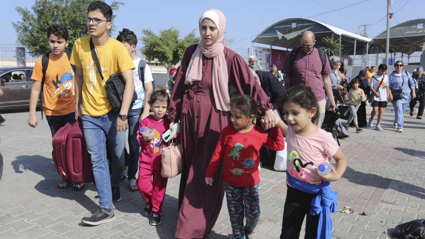 Confusion, frustration and hope at Gaza’s border with Egypt as first foreign passport-holders depart | AP News