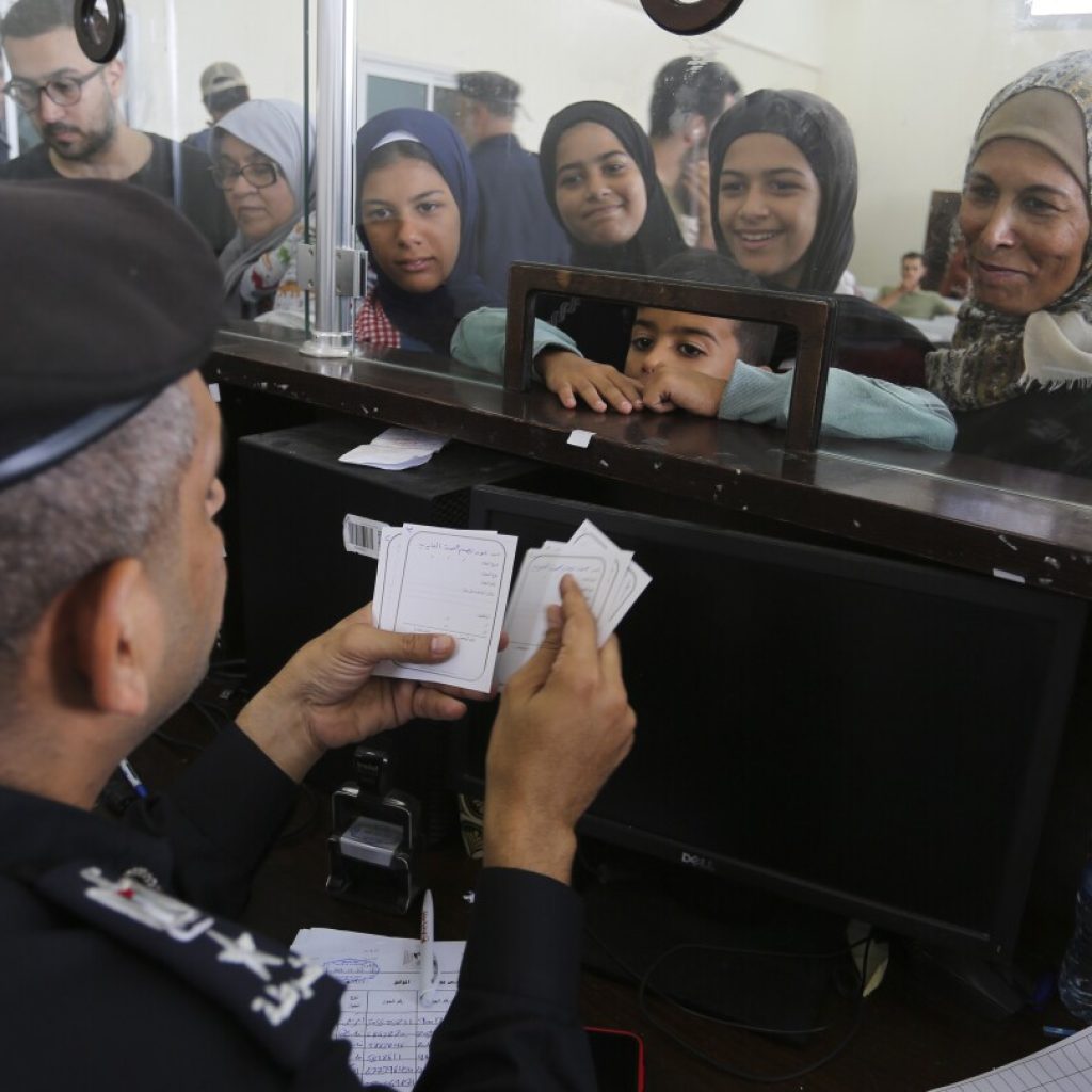 As more Palestinians with foreign citizenship leave Gaza, some families are left in the lurch | AP News