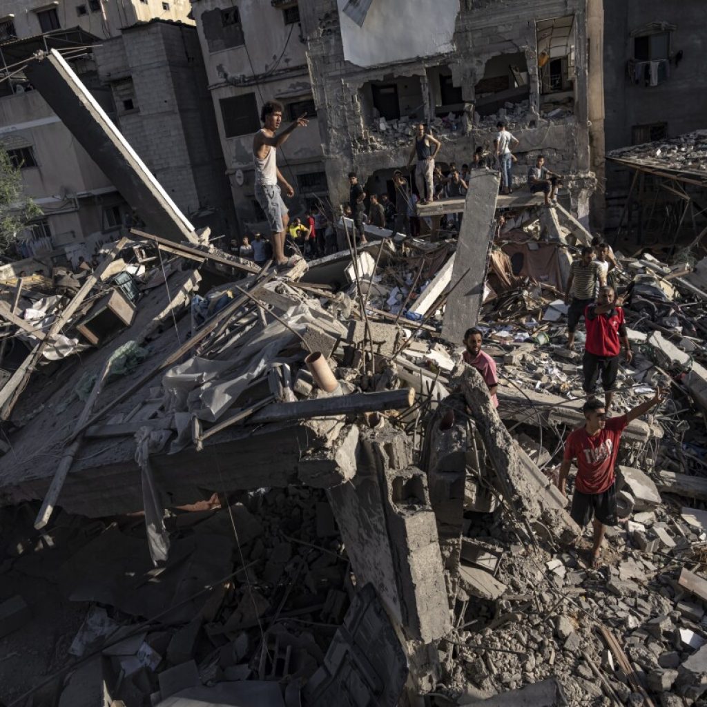 Warplanes strike Gaza refugee camp as Israel rejects US push for a pause in fighting | AP News