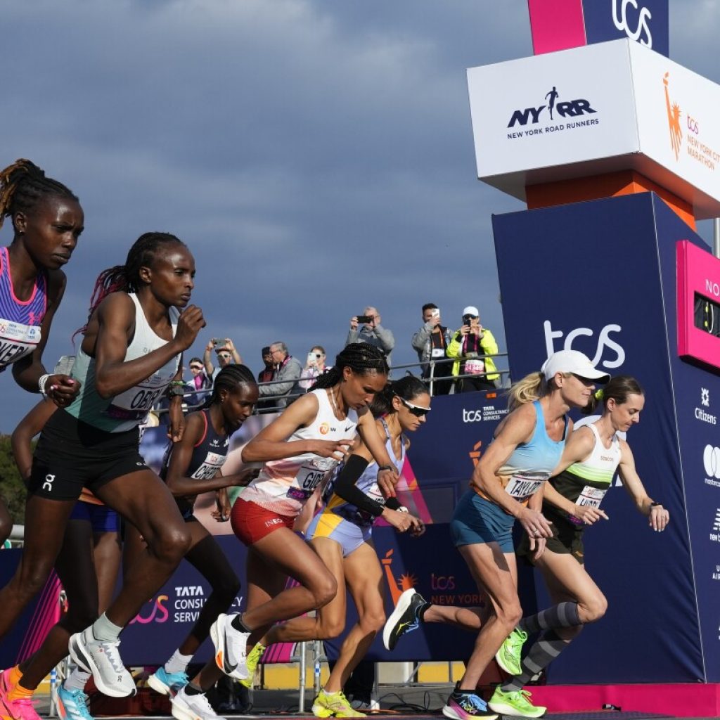 Tola sets NYC Marathon course record to win men’s race; Hellen Obiri of Kenya takes women’s title | AP News