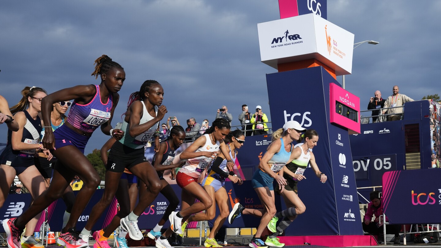 Tola sets NYC Marathon course record to win men’s race; Hellen Obiri of Kenya takes women’s title | AP News