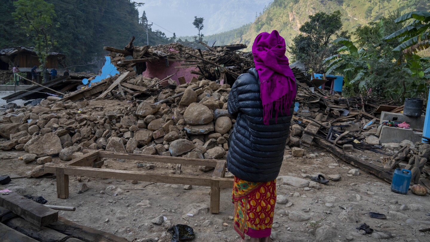 Aid trickles in to Nepal villages struck by earthquake as survivors salvage belongings from rubble | AP News