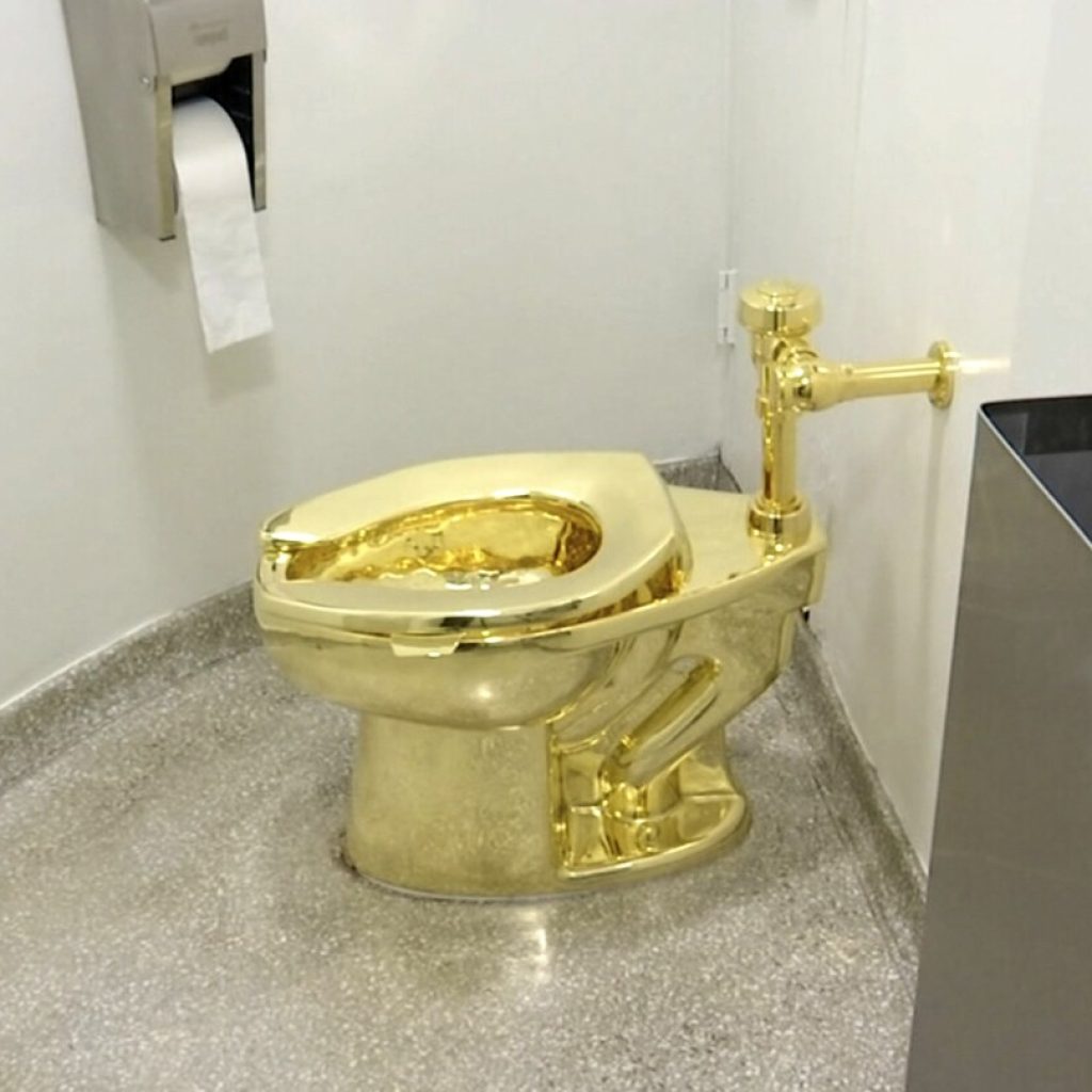 4 men charged in theft of golden toilet from Churchill’s birthplace. It’s an artwork titled America | AP News