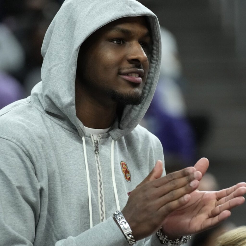 Bronny James in attendance for USC opener in Las Vegas, and LeBron James hopes for a comeback | AP News