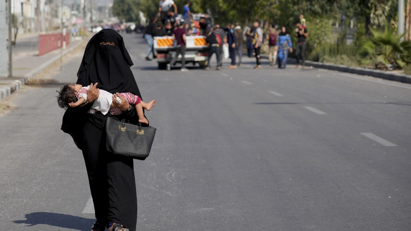 Civilians fleeing northern Gaza’s combat zone report a terrifying journey on foot past Israeli tanks | AP News