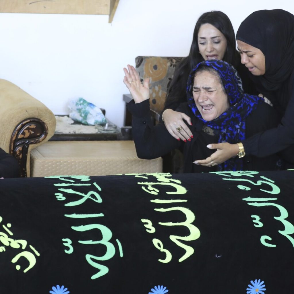 Lebanese woman and her 3 granddaughters killed in Israeli strike laid to rest | AP News