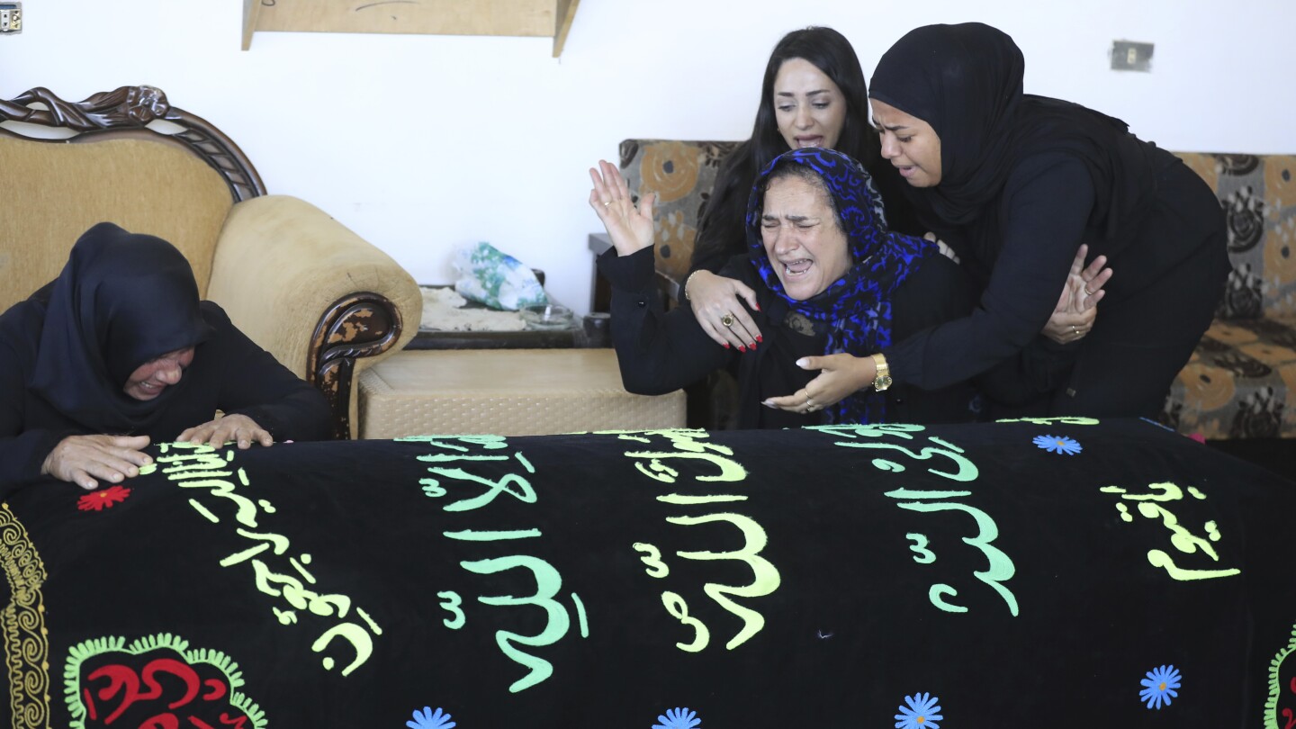 Lebanese woman and her 3 granddaughters killed in Israeli strike laid to rest | AP News