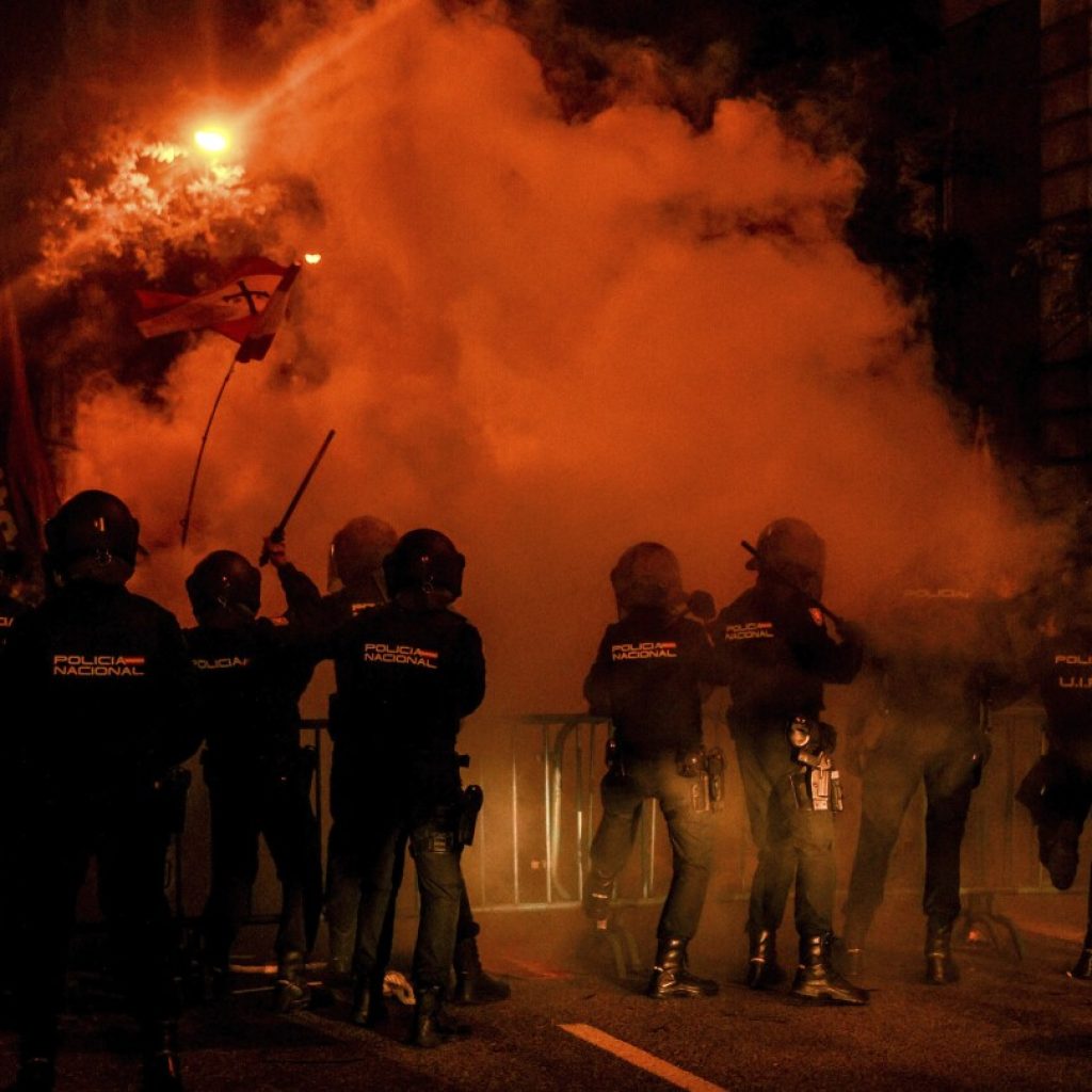 Protests turn ugly as pressure mounts on Spain’s acting government for amnesty talks with Catalans | AP News