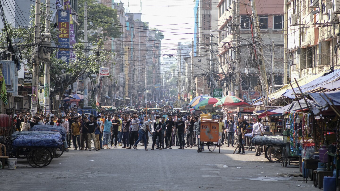 Bangladesh raises monthly minimum wage for garment workers to $113 following weeks of protests | AP News