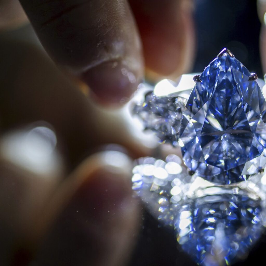 Blue diamond sells for more than $44 million at auction in Geneva | AP News