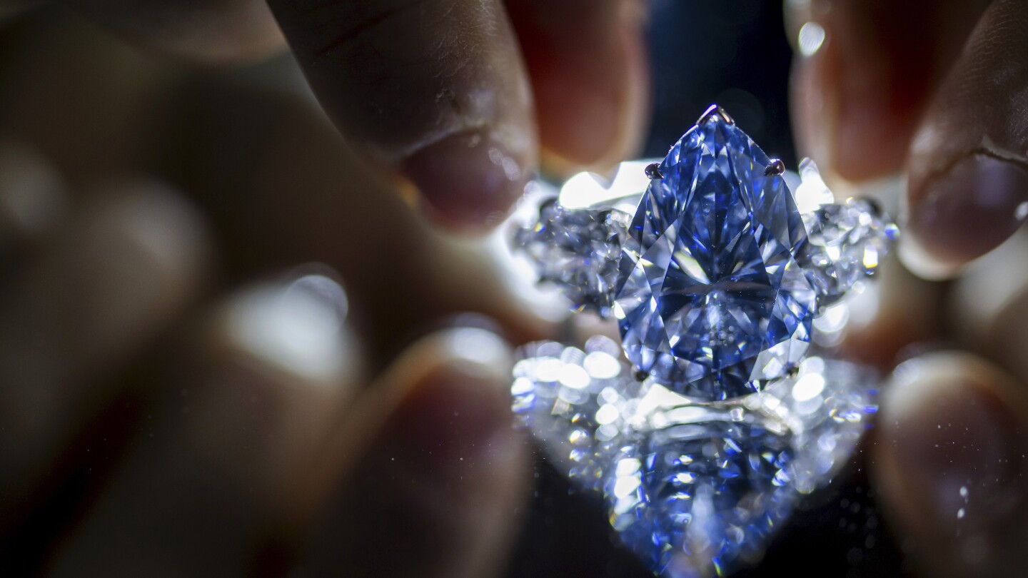 Blue diamond sells for more than $44 million at auction in Geneva | AP News