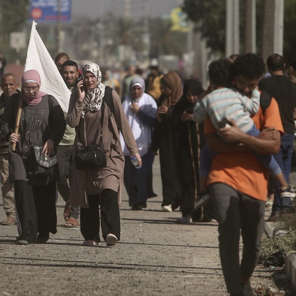 Thousands of Palestinians flee as Israel says its troops are battling inside Gaza City | AP News