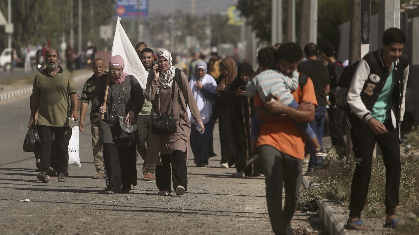 Thousands of Palestinians flee as Israel says its troops are battling inside Gaza City | AP News