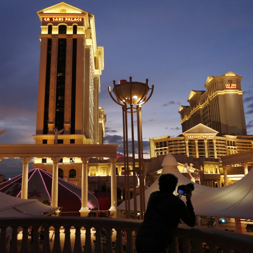 Las Vegas hotel workers union reaches tentative deal with Caesars, but threat of strike still looms | AP News