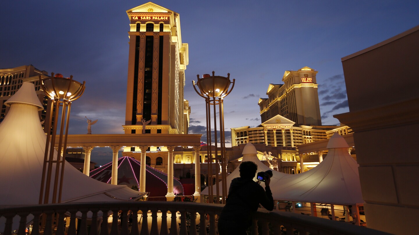 Las Vegas hotel workers union reaches tentative deal with Caesars, but threat of strike still looms | AP News