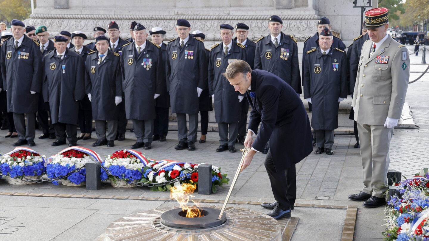 Somber bugles and bells mark Armistice Day around the globe as wars drown out peace messages | AP News