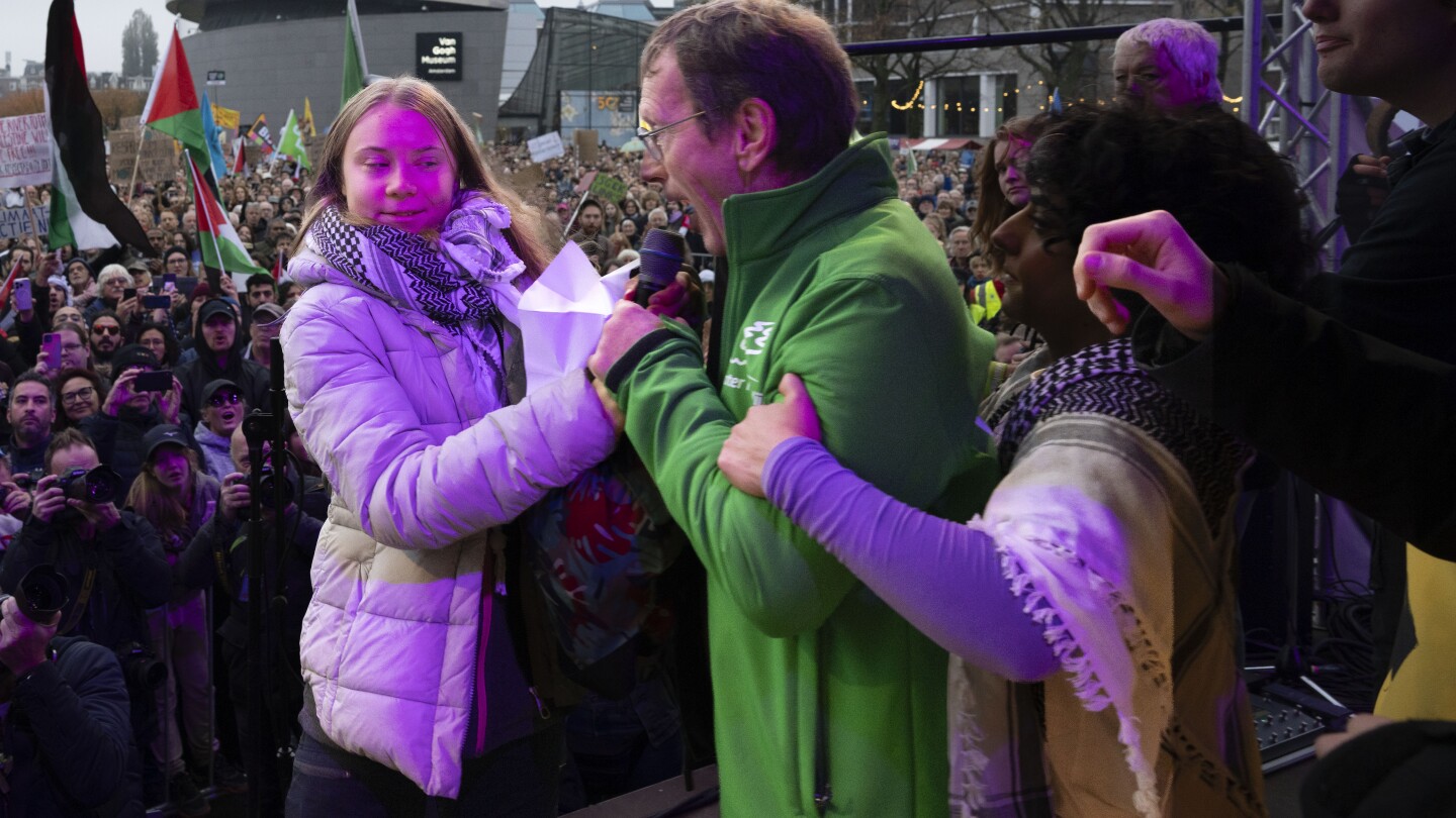 Greta Thunberg is interrupted at Dutch climate march after inviting an Afghan and a Palestinian on stage | AP News