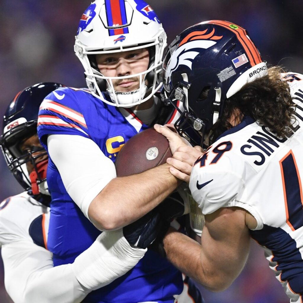 Too many injuries, turnovers and a too many men penalty costs Bills in loss to Broncos | AP News