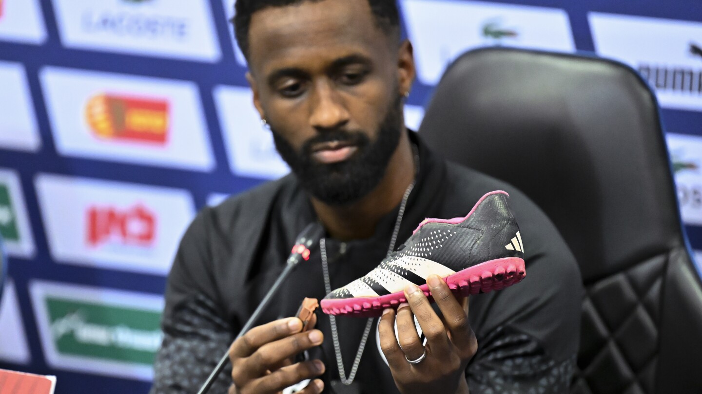 Israeli soccer team captain displays shoe of kidnapped child ahead of qualifying match in Hungary | AP News