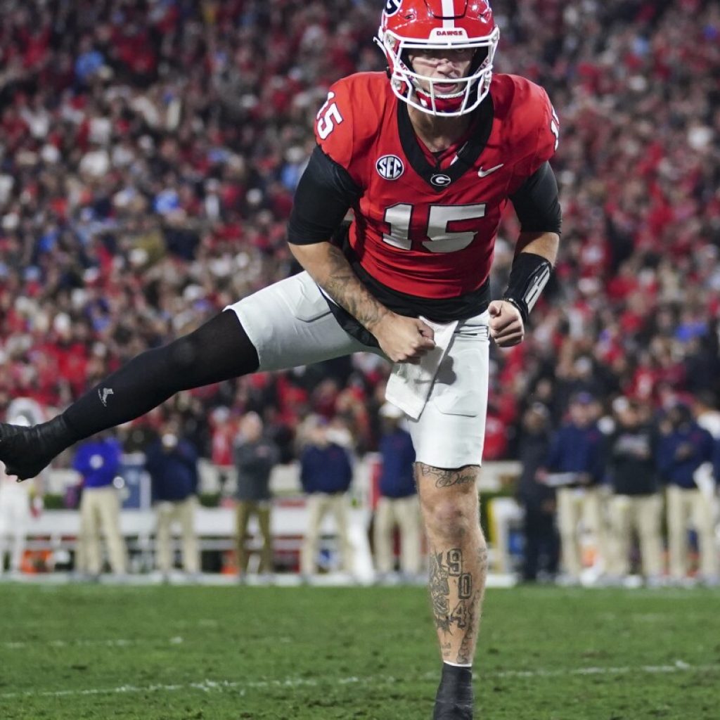 Georgia jumps to No. 1 in CFP rankings past Ohio State. Michigan and Florida State remain in top 4 | AP News